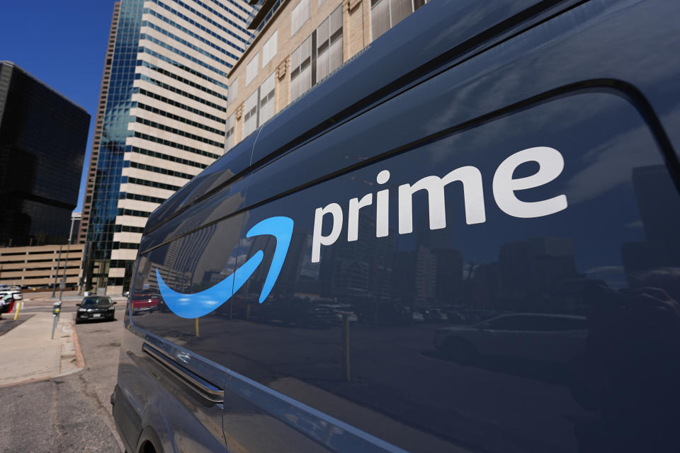 The logo adorns the side of an Amazon delivery van on Tuesday, May 14, 2024, in downtown Denver.  AP Photo/David Zalubowski)