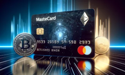 A sleek, modern Mastercard credit card with a holographic design featuring cryptocurrency symbols like Bitcoin, Ethereum, and Litecoin, set against a futuristic, digital background.