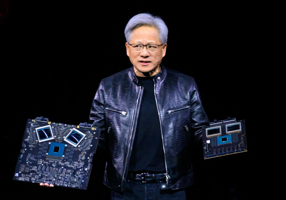 NVIDIA CEO Jensen Huang displays products on stage during the Nvidia GTC Annual Artificial Intelligence Conference at SAP Center in San Jose, California on March 18, 2024. (Photo by JOSH EDELSON/AFP) (Photo by JOSH EDELSON /AFP via Getty Images )