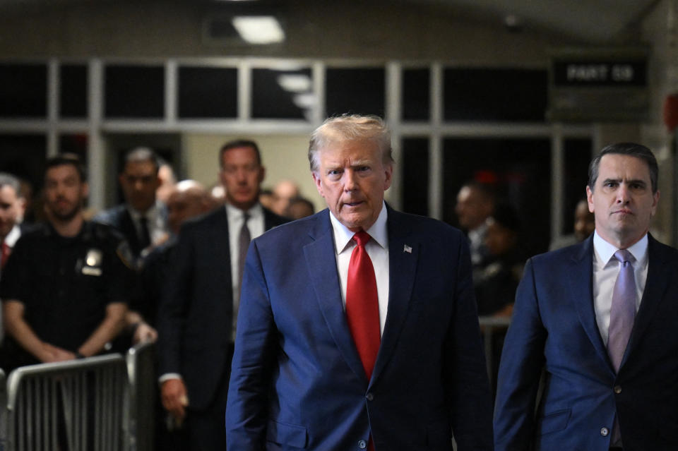 Former US President Donald Trump speaks to the press as he arrives at Manhattan Criminal Court in New York City on February 15, 2024. Trump is in court ahead of a trial for illegally covering up hush money payments made to hide extramarital affairs, including with porn star Stormy Daniels.  The hearing will see Trump's legal team attempt to dismiss the case.  (Photo by ANGELA WEISS/AFP) (Photo by ANGELA WEISS/AFP via Getty Images)