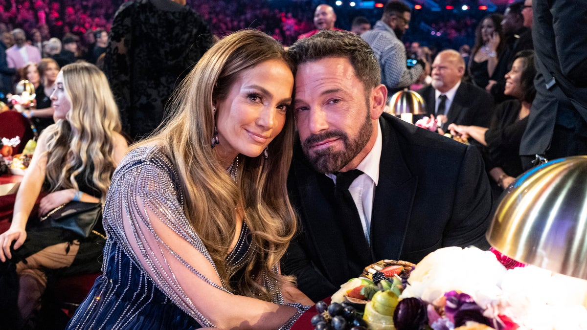 Ben Affleck and Jennifer Lopez smile at the Grammys