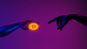 Hands imitating Michelangelo pose from the Sistine Chapel, with one hand holding a Bitcoin (BTC) coin and another hand reaching for the coin against a purple background