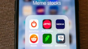 Meme stock icons on phone screen.  stock market crashes meme