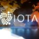 IOTA-logo-with-translucent-world-map-background.