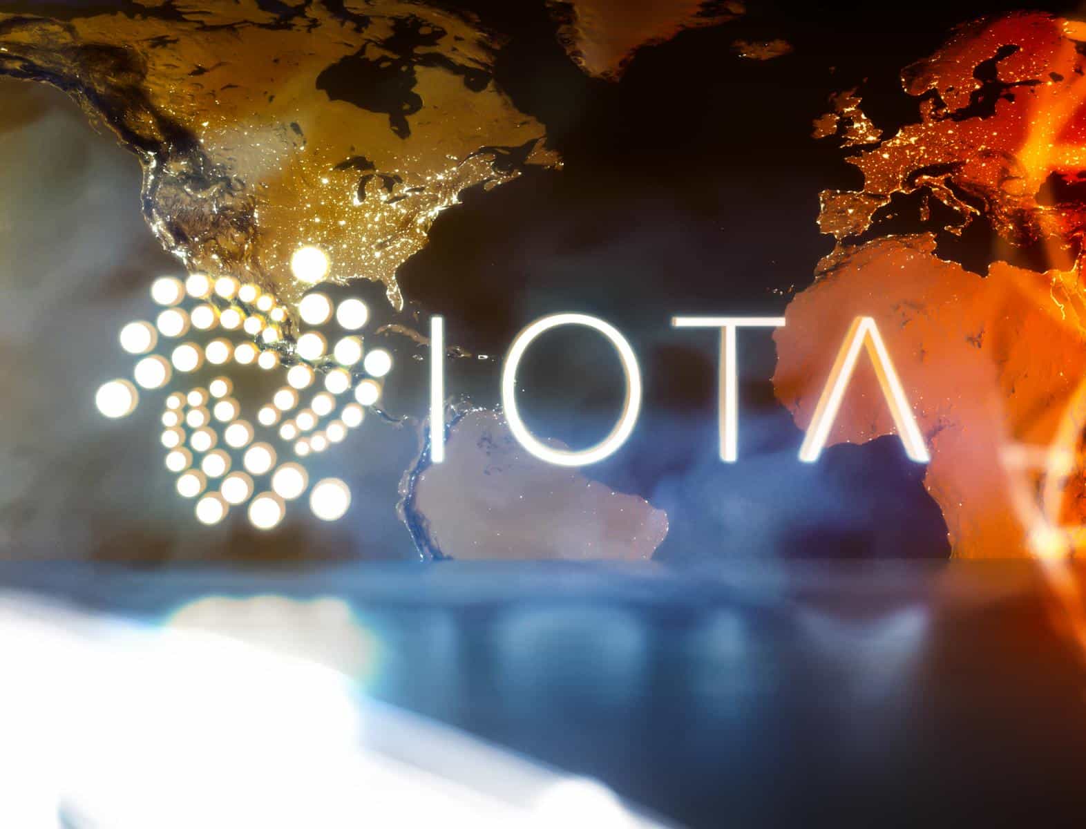 IOTA-logo-with-translucent-world-map-background.