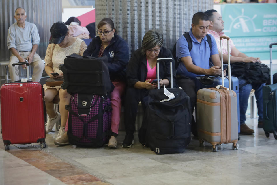 A group of passengers wait to board a flight at Mexico City International Airport on July 5, 2024, due to flight delays caused by Hurricane Beryl. (Photo by Gerardo Vieyra/NurPhoto via Getty Images)