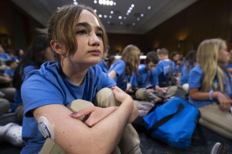 Bay Saunders, 12, with a Dexcom G6 patch on her arm for treatment of type 1 diabetes, attends a Senate Appropriations Committee hearing on how the Special Diabetes Program is creating hope for those living with type 1 diabetes, along with other children with type 1 diabetes, Tuesday, July 11, 2023, in Washington. (AP Photo/Manuel Balce Ceneta)